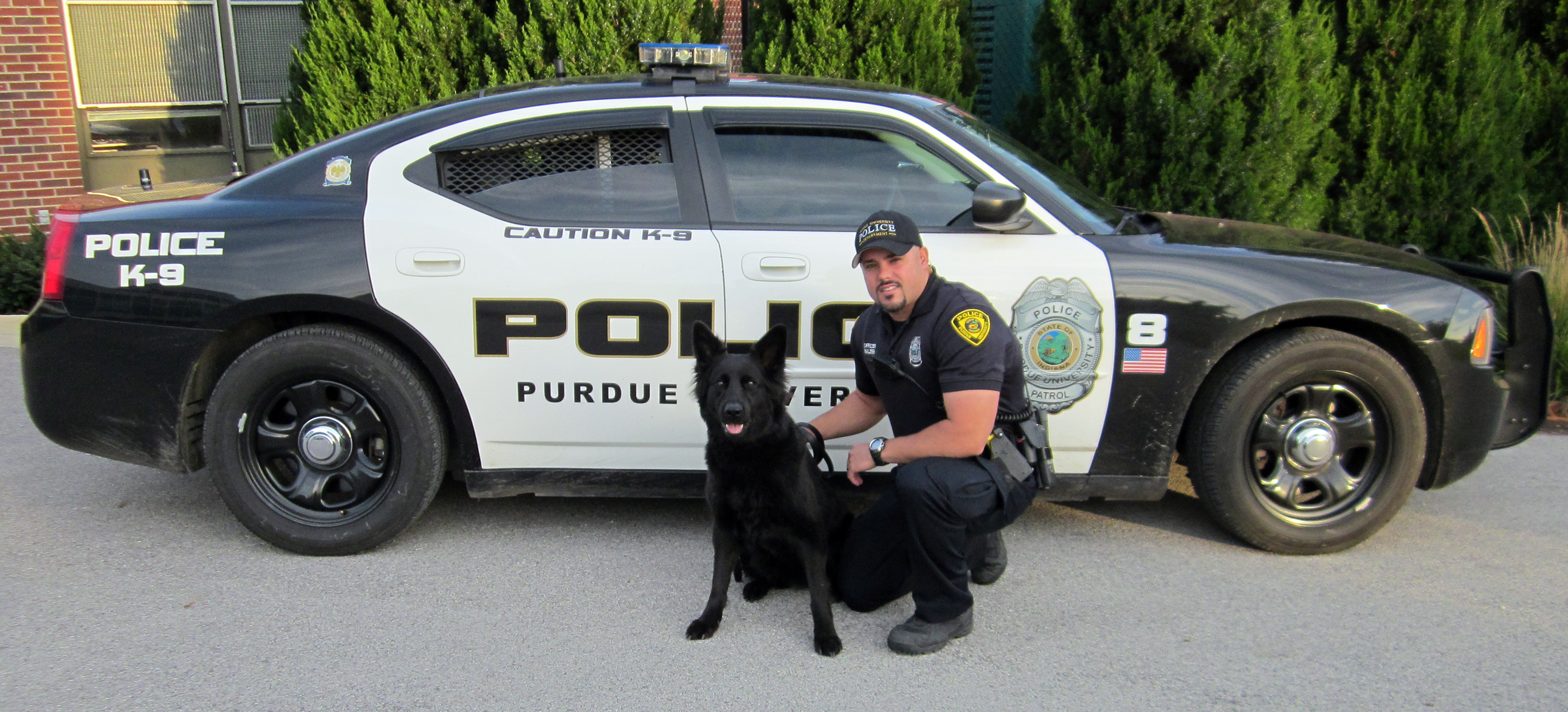 Purdue University police officer Kevin Balzer with Vara, a 2-year-old German shepherd. (Purdue University photo)